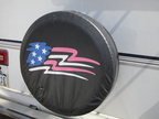 custom wheel cover on back of RV