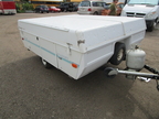 closed popup RV in yard