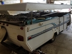 popup top RV in shop